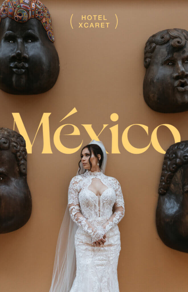 Bride Karissa posing beside sculptural masks at Hotel Xcaret Mexico.